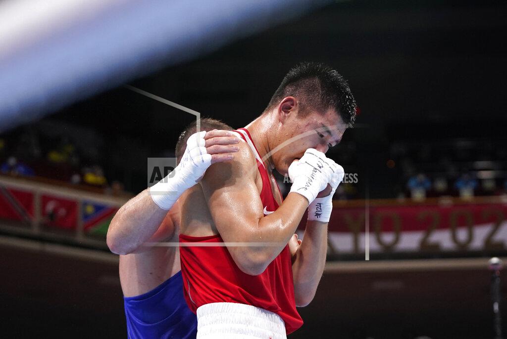 Frank Franklin Ii Russian Olympic Committee's Imam Khataev comforts Kazakhstan's Bekzad Nurdauletov after the former won the men's light heavyweight 81-kg preliminaries boxing match at the 2020 Summer Olympics, Wednesday, July 28, 2021, in Tokyo, Japan. (AP Photo/Frank Franklin II, Pool)