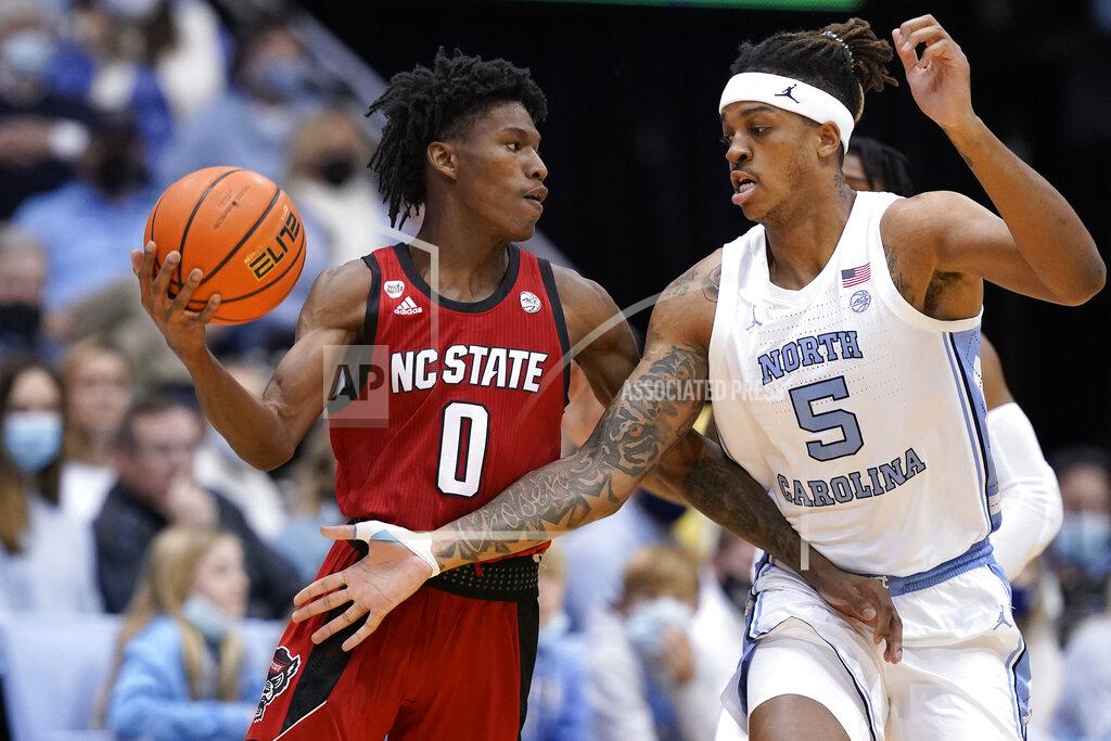 Gerry Broome North Carolina forward Armando Bacot (5) pressures North Carolina State guard Terquavion Smith (0) during the first half of an NCAA college basketball game in Chapel Hill, N.C., Saturday, Jan. 29, 2022. (AP Photo/Gerry Broome)