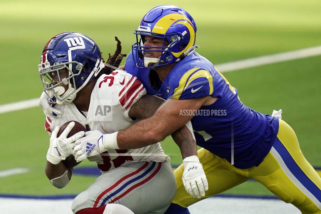 Jae C. Hong New York Giants running back Devonta Freeman, left, is tackled by Los Angeles Rams linebacker Troy Reeder during the second half of an NFL football game Sunday, Oct. 4, 2020, in Inglewood, Calif. (AP Photo/Jae C. Hong)