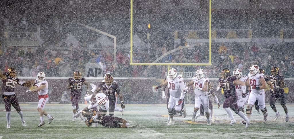 Elizabeth Flores In a snowy and wintery backdrop, Minnesota defensive back Antoine Winfield Jr. tackles Wisconsin running back Bradrick Shaw during the fourth quarter of an NCAA college football game Saturday, Nov. 30, 2019, in Minneapolis. (Elizabeth Flores/Star Tribune via AP)