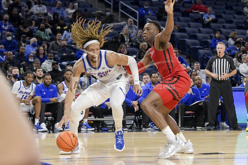 Mark Black DePaul's Brandon Johnson, left, drives around Rutgers' Aundre Hyatt, right, during the second half of an NCAA college basketball game Thursday, Nov. 18, 2021, in Chicago. (AP Photo/Mark Black)
