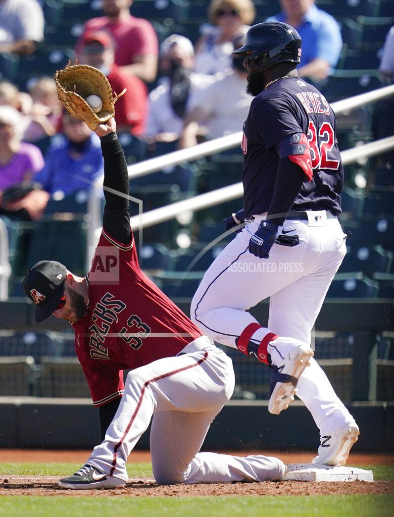 Ross D. Franklin Arizona Diamondbacks first baseman Christian Walker (53) makes a catch at first base to get Cleveland Indians' Franmil Reyes out on an infield grounder during the second inning of a spring training baseball game Wednesday, March 3, 2021, in Goodyear, Ariz. (AP Photo/Ross D. Franklin)