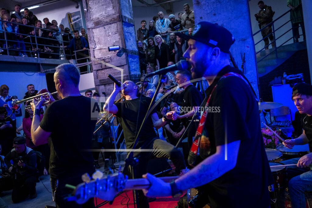 Bernat Armangue Ukrainian poet and musician Serhiy Zhadan, center, sings during "The music of the resistance" concert at an art gallery in Kharkiv, east Ukraine, Saturday, May 14, 2022. (AP Photo/Bernat Armangue)