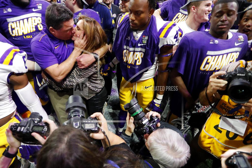 John Bazemore LSU coach Ed Orgeron kisses his wife, Kelly, after the team's Peach Bowl NCAA semifinal college football playoff game against Oklahoma, Saturday, Dec. 28, 2019, in Atlanta. LSU won 63-28. (AP Photo/John Bazemore)