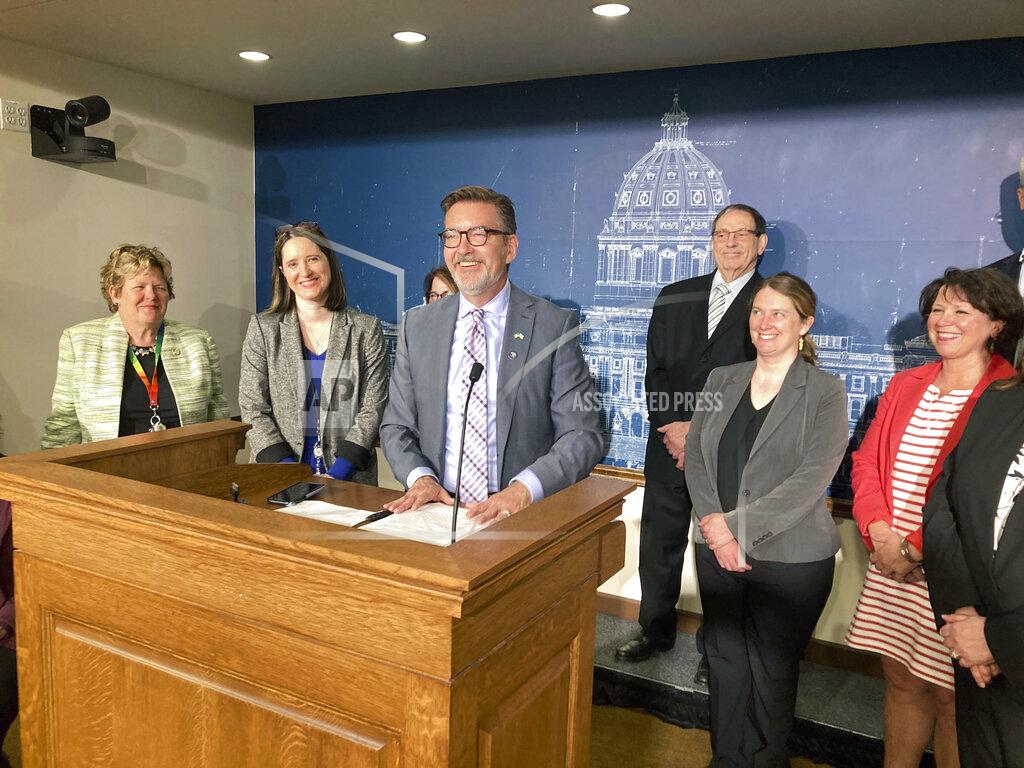 Steve Karnowski Democratic Minnesota state Sen. Scott Dibble, flanked by fellow Senate Democrats, speaks to reporters at the State Capitol in St. Paul, Minn. on Thursday, May 19, 2022, about efforts to pass a ban on “conversion therapy” for LGBTQ youth. Dibble’s bill won a majority in the Republican-controlled Minnesota Senate, but it didn’t get enough votes on a procedural maneuver to advance to a full debate on the bill's merits. AP Photo/Steve Karnowski)