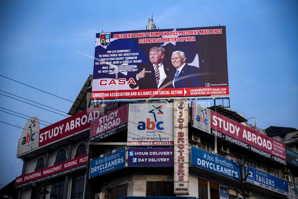 R S Iyer FILE - In this Oct. 31, 2020 file photo a billboard erected by supporters of President Donald Trump and Vice President Mike Pence stands at a city square in Kochi, in the southern Indian state of Kerala. Despite some friction over trade issues, the India-U.S. relationship has steadily strengthened in security and defense cooperation in the last four years. It has largely been defined by public displays of bonhomie between President Donald Trump and Indian Prime Minister Narendra Modi, both seen as populists. (AP Photo/R S Iyer, File)