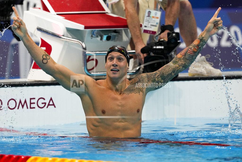 Caeleb Dressel, of the United States, celebrates after winning the men's 100-meter freestyle final at the 2020 Summer Olympics, Thursday, July 29, 2021, in Tokyo, Japan. (AP Photo/Martin Meissner)