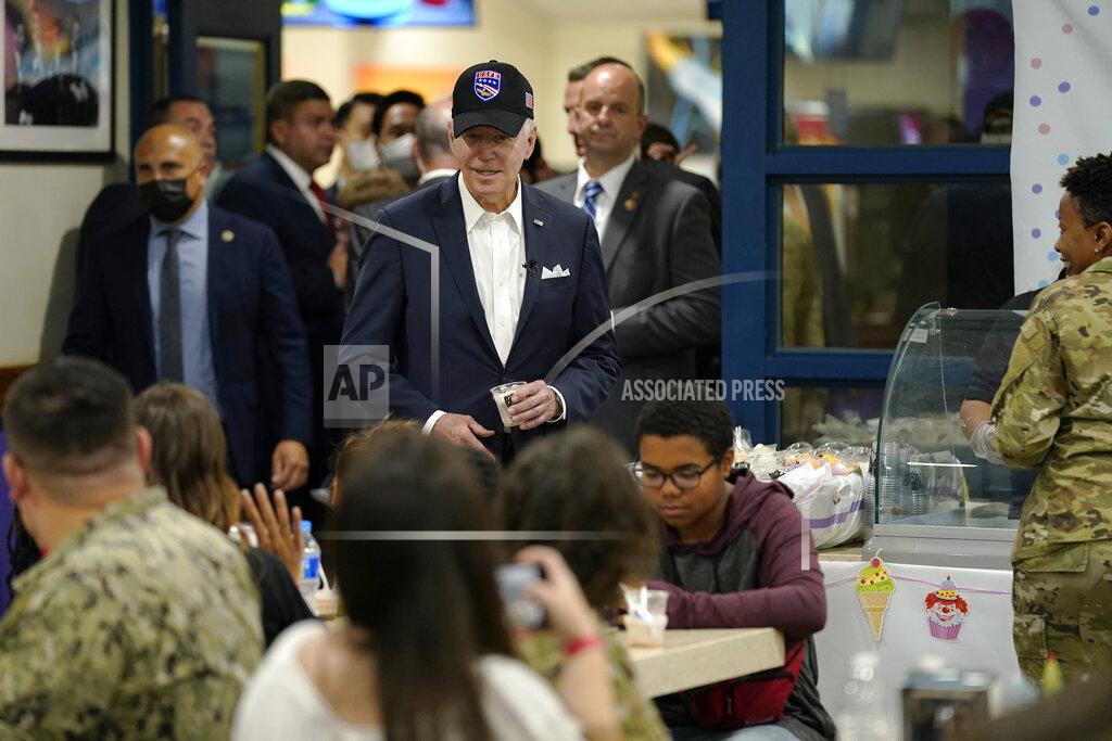 Evan Vucci U.S. President Joe Biden, center, meets with American service members and their family at Osan Air Base, Sunday, May 22, 2022, in Pyeongtaek, South Korea. (AP Photo/Evan Vucci)