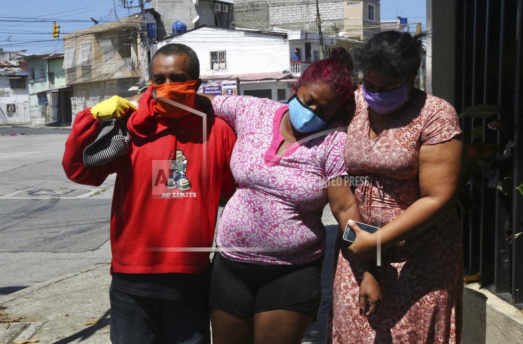 Angel De Jesus FILE - In this April 16, 2020 file photo, Mariela Jacome, right, helps her mother Catherine Quinonez who Mariela says is experiencing symptoms associated with COVID-19, as they arrive to a hospital in Guayaquil, Ecuador. In March and April, Guayaquil was a pandemic hellscape of makeshift morgues, hundreds dying at home, bodies left in the street. But Guayaquil has stabilized since then, sending medical teams and equipment elsewhere in Ecuador and taking in virus patients from outside the city. (AP Photo/Angel de Jesus, File)
