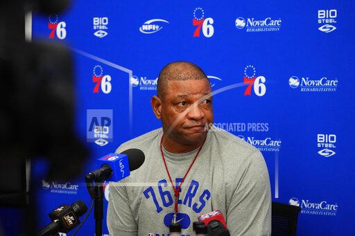 Philadelphia 76ers' Doc Rivers listens to a question while speaking with the media at the team's NBA basketball practice facility, Wednesday, Oct. 13, 2021, in Camden, N.J. (AP Photo/Matt Slocum)