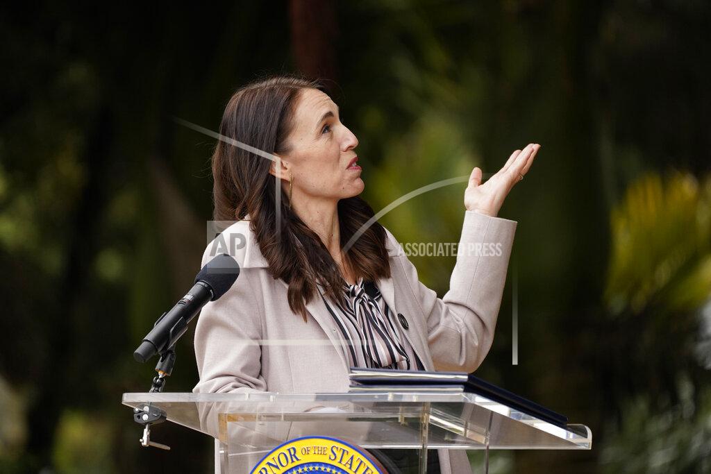 Eric Risberg New Zealand Prime Minister Jacinda Ardern gestures toward a tree behind her while speaking at the San Francisco Botanical Garden in San Francisco, Friday, May 27, 2022. Gov. Newsom met with Ardern in Golden Gate Park "to establish a new international partnership tackling climate change." (AP Photo/Eric Risberg)