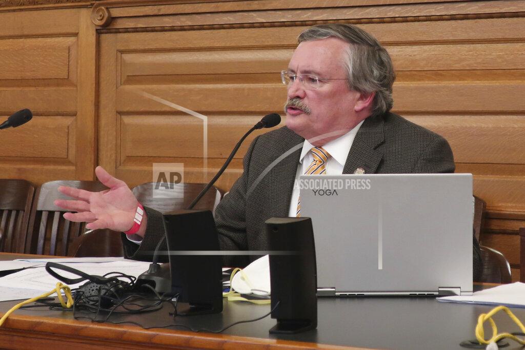 John Hanna FILE - In this Thursday, May 21, 2020 file photo, state Rep. John Carmichael, D-Wichita, speaks during negotiations between the House and Senate over the final contents of a bill that would limit Democratic Gov. Laura Kelly's power to direct the state's response to the coronavirus pandemic, at the Statehouse in Topeka, Kan. “The power of the executive has been emasculated when it comes to the Emergency Management Act,” Carmichael says. “That may have very dire consequences in other circumstances and other disasters.” (AP Photo/John Hanna)