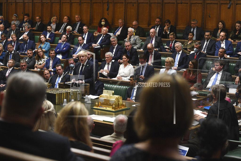 Jessica Taylor FILE - In this Sept. 7, 2021, file photo, provided by UK Parliament, Britain's Prime Minister Boris Johnson speaks in the House of Commons, London. Britons are encouraged these days — though in most cases not required — to wear face coverings in crowded indoor spaces. But Johnson regularly appears in the packed, poorly ventilated House of Commons cheek-by-jowl with other maskless Conservative lawmakers. (Jessica Taylor/UK Parliament via AP, File)