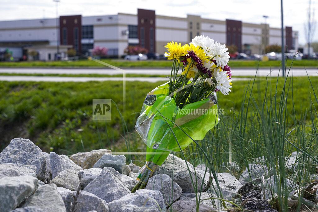 Michael Conroy A single bouquet of flower sits in the rocks across the street from the FedEx facility in Indianapolis, Saturday, April 17, 2021 where eight people were shot and killed. A gunman killed eight people and wounded several others before apparently taking his own life in a late-night attack at a FedEx facility near the Indianapolis airport, police said, in the latest in a spate of mass shootings in the United States after a relative lull during the pandemic. (AP Photo/Michael Conroy)