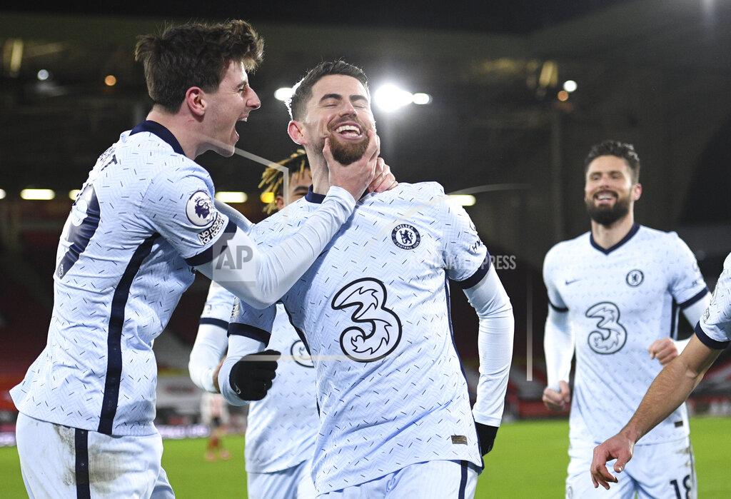 Oli Scarff Chelsea's Jorginho, centre, celebrates after scoring the 2-1 lead from the penalty spot during the English Premier League soccer match between Sheffield United and Chelsea at Bramall Lane stadium in Sheffield, England, Sunday, Feb. 7, 2021. (Oli Scarff/ Pool via AP)