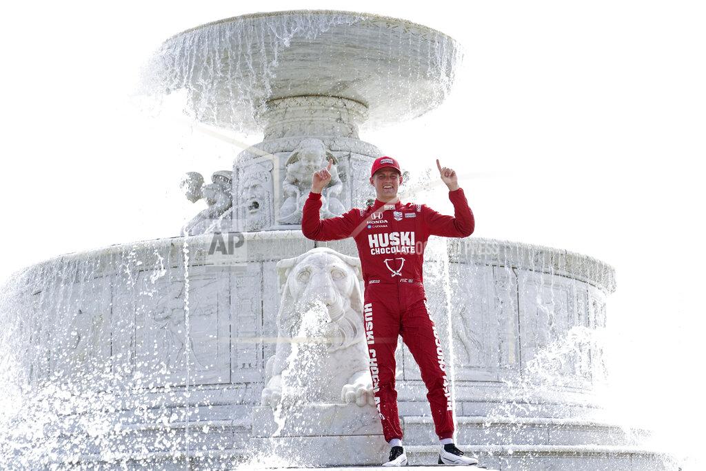 Marcus Ericsson, of Sweden, celebrates winning the first race of the IndyCar Detroit Grand Prix auto racing doubleheader on Belle Isle in Detroit, Saturday, June 12, 2021. (AP Photo/Paul Sancya)