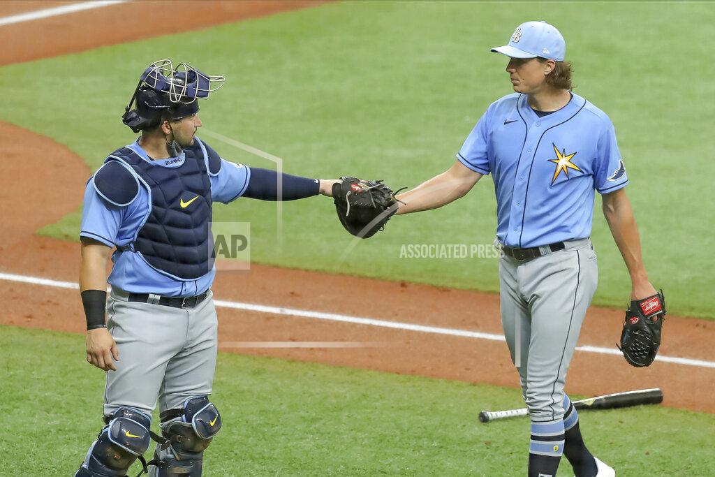 Mike Carlson Tampa Bay Rays' Tyler Glasnow, right, bumps fists with catcher Mike Zunino after pitching during baseball practice Tuesday, July 14, 2020, in St. Petersburg, Fla. (AP Photo/Mike Carlson)