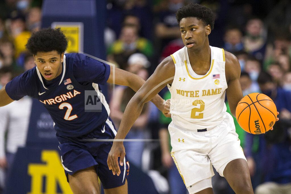 Robert Franklin Notre Dame's Trey Wertz, right, drives downcourt next to Virginia's Reece Beekman during the second half of an NCAA college basketball game Saturday, Jan. 29, 2022, in South Bend, Ind. (AP Photo/Robert Franklin)