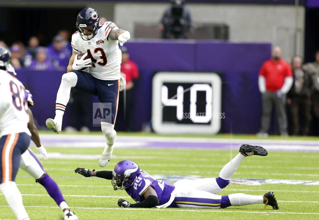 Andy Clayton-King Chicago Bears tight end Eric Saubert (43) leaps over Minnesota Vikings cornerback Mackensie Alexander, right, during the first half of an NFL football game, Sunday, Dec. 29, 2019, in Minneapolis. (AP Photo/Andy Clayton-King)