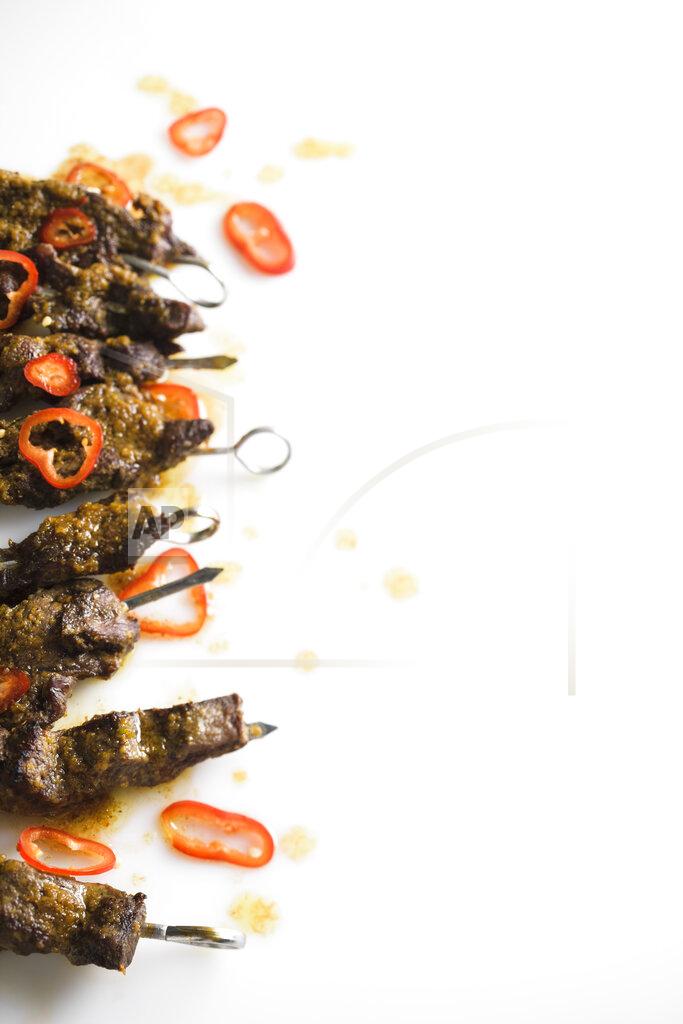 Uncredited This image released by Milk Street shows a recipe for Curried Beef Skewers. (Milk Street via AP)