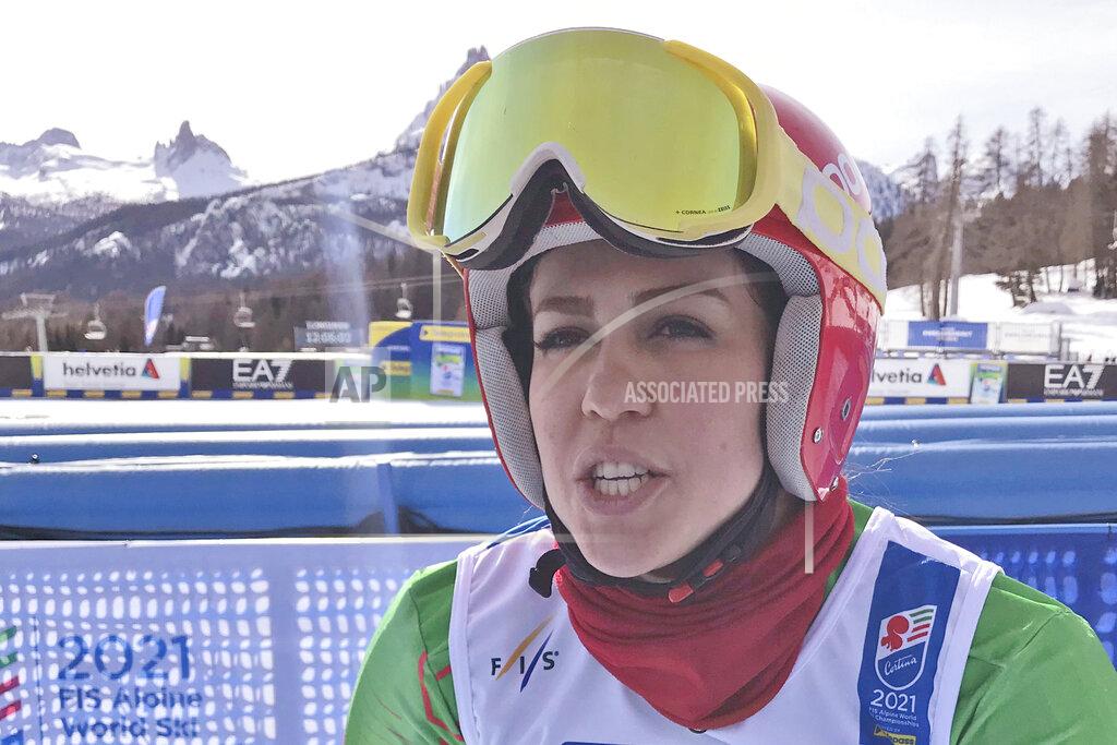 Iran's Forough Abbasi is interviewed in the finish area after the first run of a women's giant slalom, at the alpine ski World Championships, in Cortina d'Ampezzo, Italy, Thursday, Feb. 18, 2021. (AP Photo/Andrew Dampf)