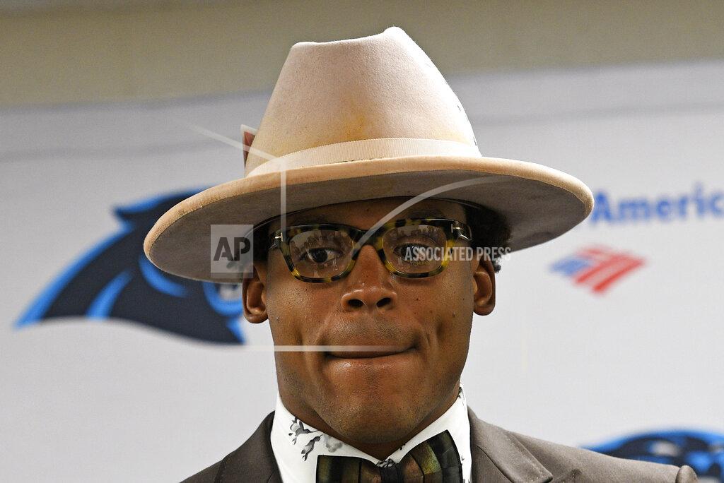 Don Wright FILE - In this Nov. 9, 2018, file photo, Carolina Panthers quarterback Cam Newton talks with reporters following a 52-21 loss to the Pittsburgh Steelers in an NFL football game in Pittsburgh. The Panthers are parting ways with Cam Newton. Carolina general manager Marty Hurney said Tuesday, March 17, 2020, via Twitter the team is giving the 31-year-old quarterback permission to seek a trade _ although the former league MVP responded by saying he never requested one. (AP Photo/Don Wright, File)