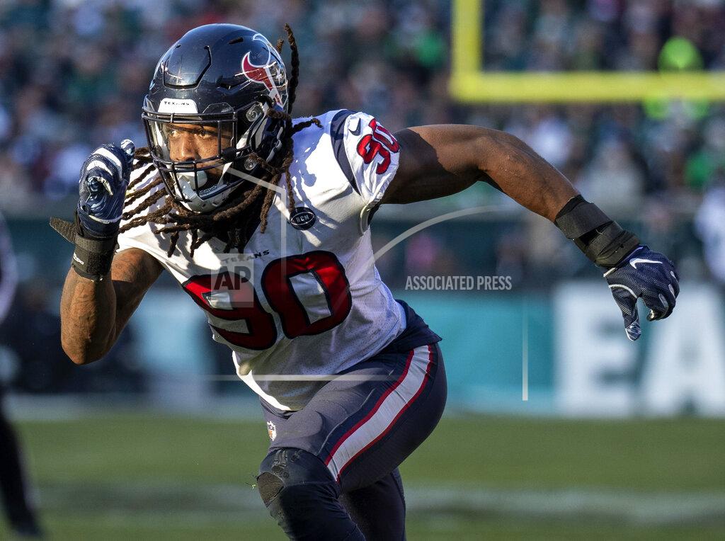 FILE - In this Dec. 23, 2018, file photo, Houston Texans' Jadeveon Clowney rushes during an NFL football game against the Philadelphia Eagles in Philadelphia. Houston added six players in four trades this weekend, which included a deal that sent 2014 top overall pick Clowney to the Seattle Seahawks after the team could not agree on a long-term deal with the defensive end. (AP Photo/Chris Szagola, File)