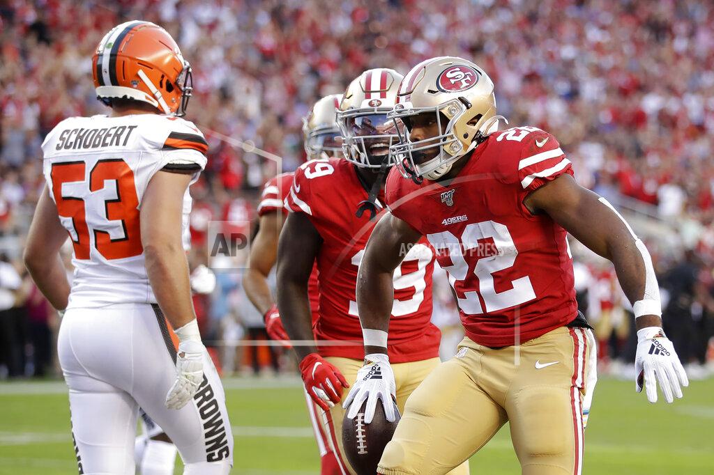 Ben Margot San Francisco 49ers running back Matt Breida (22) celebrates with wide receiver Deebo Samuel after scoring against the Cleveland Browns during the first half of an NFL football game in Santa Clara, Calif., Monday, Oct. 7, 2019. At left is middle linebacker Joe Schobert (53). (AP Photo/Ben Margot)