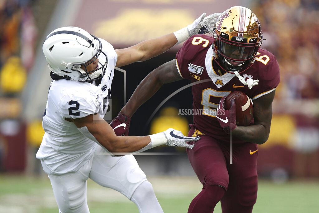 Stacy Bengs Minnesota wide receiver Tyler Johnson (6) holds onto the ball against Penn State cornerback Keaton Ellis (2) during an NCAA college football game, Saturday, Nov. 9, 2019, in Minneapolis. (AP Photo/Stacy Bengs)