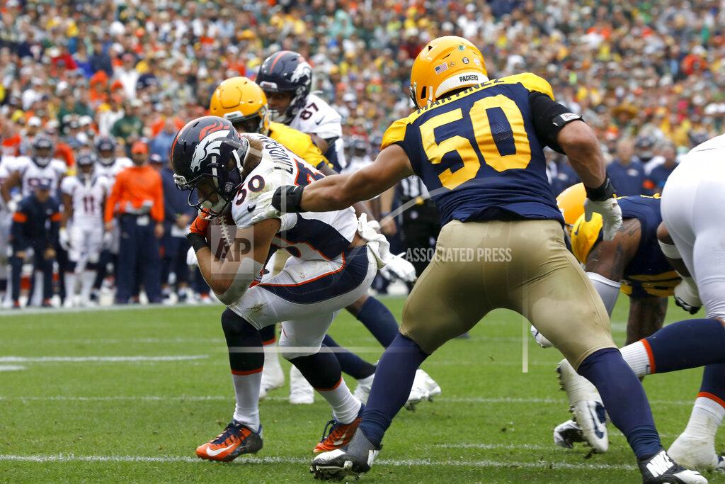 Mike Roemer Denver Broncos running back Phillip Lindsay (30) scores past Green Bay Packers inside linebacker Blake Martinez (50) during the first half of an NFL football game Sunday, Sept. 22, 2019, in Green Bay, Wis. (AP Photo/Mike Roemer)