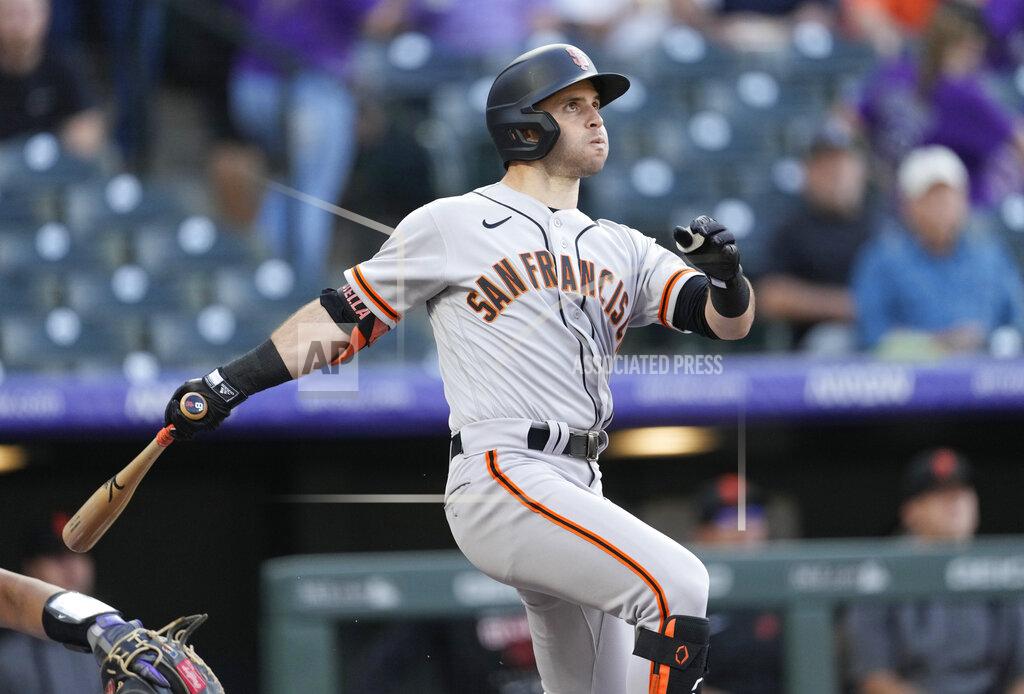 David Zalubowski San Francisco Giants' Tommy La Stella follows the flight of his solo home run off Colorado Rockies starting pitcher Chad Kuhl in the first inning of a baseball game Tuesday, May 17, 2022, in Denver. (AP Photo/David Zalubowski)