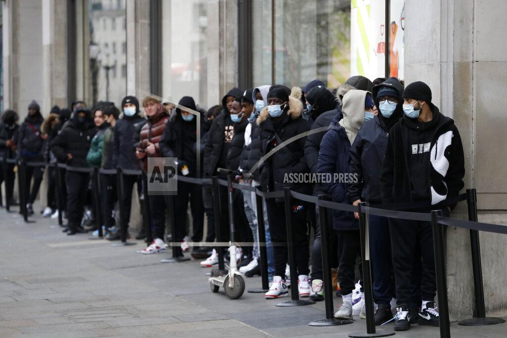 Kirsty Wigglesworth A queue grows big as people wait to enter a Nike Town shop on Oxford Street in London, early Monday morning, April 12, 2021. Millions of people in England will get their first chance in months for haircuts, casual shopping and restaurant meals on Monday, as the government takes the next step on its lockdown-lifting road map. (AP Photo/Kirsty Wigglesworth)