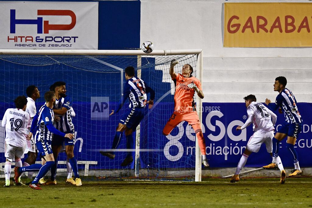 Jose Breton Real Madrid's goalkeeper Andriy Lunin jumps to punch the ball away during a Spanish Copa del Rey round of 32 soccer match between Alcoyano and Real Madrid at the El Collao stadium in Alcoy, Spain, Wednesday Jan. 20, 2021. (AP Photo/Jose Breton)