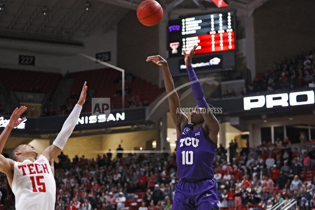 Brad Tollefson TCU's Damion Baugh (10) shoots over Texas Tech's Kevin McCullar (15) during the first half of an NCAA college basketball game on Saturday, Feb. 12, 2022, in Lubbock, Texas. (AP Photo/Brad Tollefson)