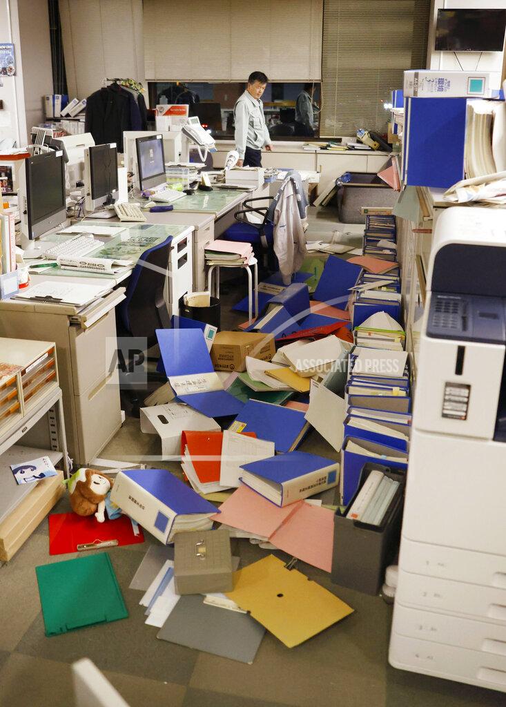 Naoya Osato Files are scattered on the floor following an earthquake at a town office in Hironomachi, Fukushima prefecture, northeastern Japan Saturday, Feb. 13, 2021. A strong earthquake hit off the coast of northeastern Japan late Saturday, shaking Fukushima, Miyagi and other areas, but there was no threat of a tsunami, officials said. (Naoya Osato/Kyodo News via AP)