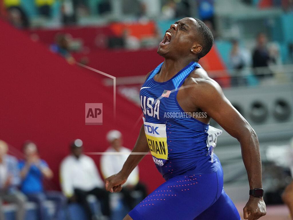 David J. Phillip FILE - In this file photo dated Saturday, Sept. 28, 2019, Christian Coleman, of the United States, celebrates winning the gold medal in Doha, Qatar. Men’s 100-meter world champion Christian Coleman has been banned for two years until May 2022, for missing three doping control tests, according to officials Tuesday Oct. 27, 2020. (AP Photo/David J. Phillip, FILE)