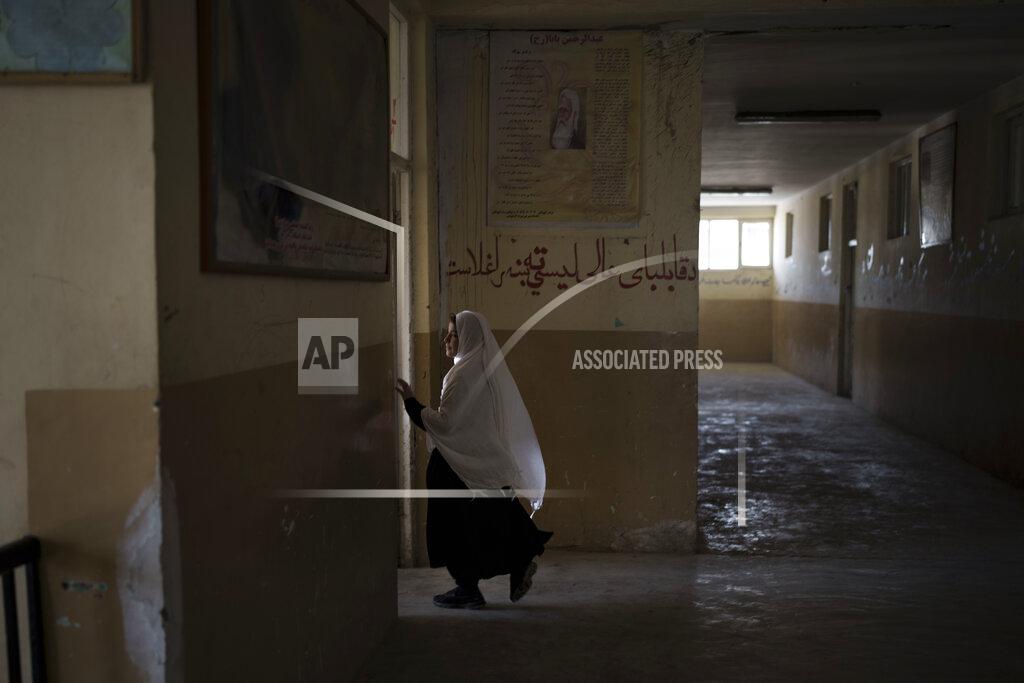 Felipe Dana A girl walks into her classroom at a school in Kabul, Afghanistan, Sunday, Sept. 12, 2021. (AP Photo/Felipe Dana)