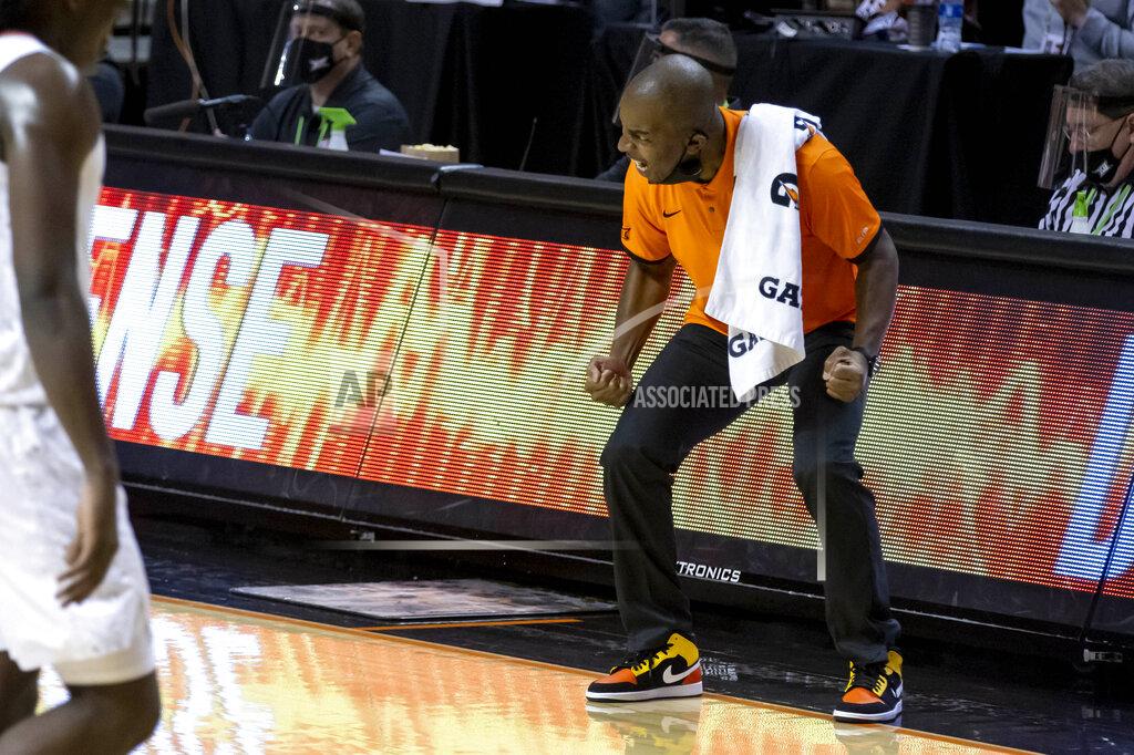 Mitch Alcala Oklahoma State head coach Mike Boynton Jr. celebrates on the baseline during the first half of an NCAA college basketball game against Oakland in Stillwater, Okla., Saturday, Dec. 5, 2020. (AP Photo/Mitch Alcala)