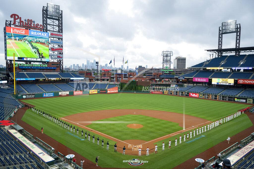 Chris Szagola Miami Marlins, left, and Philadelphia Phillies, right, hold a black ribbon in support of the Black Lives Matter movement prior to a baseball game, Friday, July 24, 2020, in Philadelphia. (AP Photo/Chris Szagola)