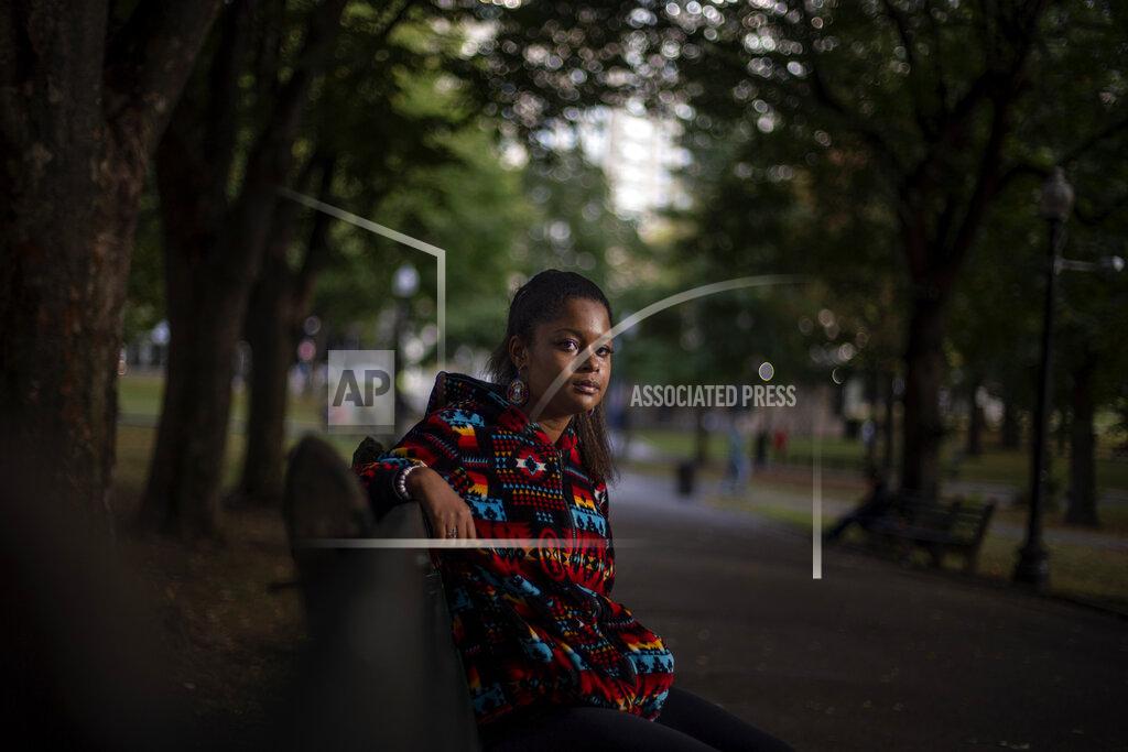 David Goldman Alyssa Harris, 18, a member of the Mashpee Wampanoag Tribe, sits for a portrait in a park in Boston, Friday, Oct. 2, 2020. "I just feel like this is the four hundredth anniversary of colonization. And I mean, why why would I celebrate that? Like, celebrating getting my culture, language, land taken away? Four hundred years ago was the start of all that," said Harris who also works as a historical educator. "But then on top of that, since there's this anniversary, I've been given the opportunity to use my voice, whereas in prior years I've never been asked to. I definitely think people will listen more, especially because there's the Black Lives Matter movement, which is already influencing people to learn more about history." (AP Photo/David Goldman)