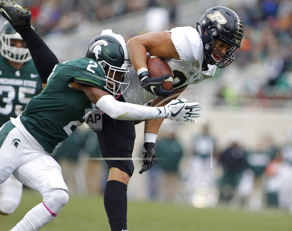 Al Goldis Purdue's Brycen Hopkins, right, is brought down by Michigan State's Justin Layne (2) on a pass reception during the first quarter of an NCAA college football game, Saturday, Oct. 27, 2018, in East Lansing, Mich. (AP Photo/Al Goldis)