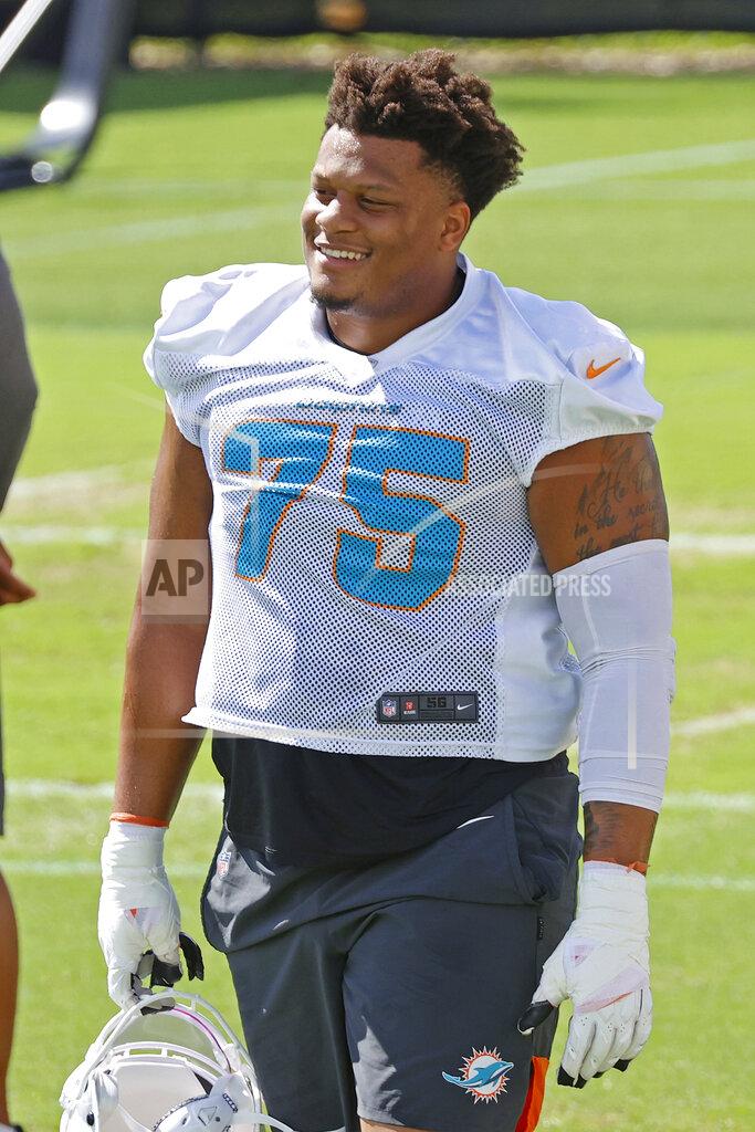 Joel Auerbach Miami Dolphins Ereck Flowers (75) looks on between drills during NFL football practice in Davie, Fla., Friday, Sept. 11, 2020. (AP Photo/Joel Auerbach)