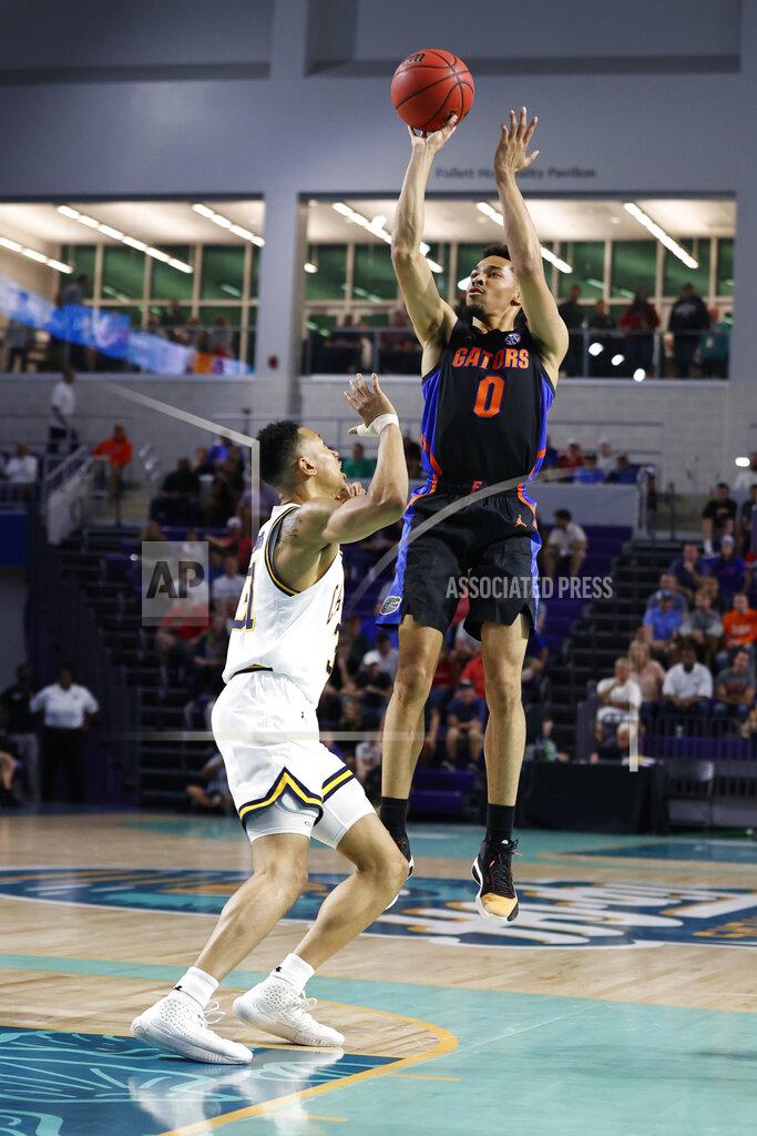 Scott Audette Florida guard Myreon Jones (0) shoots over California guard Jordan Shepherd (31) during the first half of an NCAA college basketball game on Monday, Nov. 22, 2021, in Fort Myers, Fla. (AP Photo/Scott Audette)