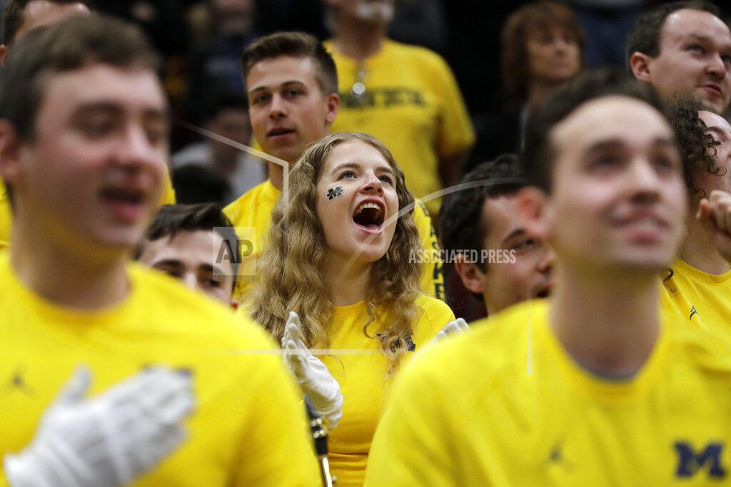 Nam Y. Huh Michigan band members cheer during the first half of an NCAA college basketball game between Michigan and Iowa in the quarterfinals of the Big Ten Conference tournament, Friday, March 15, 2019, in Chicago. (AP Photo/Nam Y. Huh)