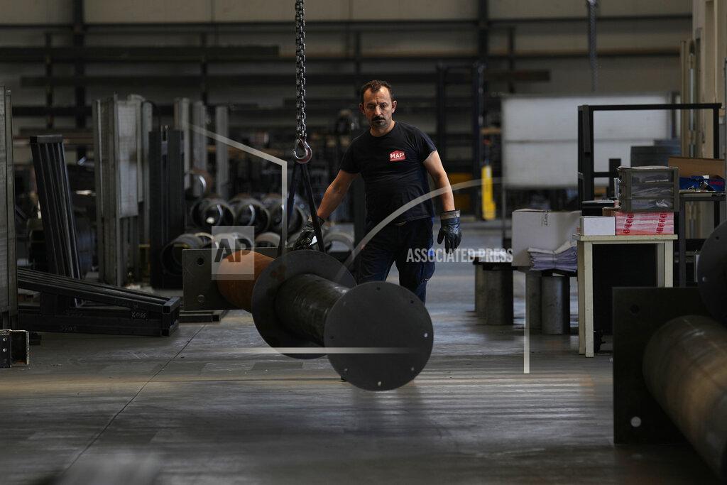 Antonio Calanni A man works at MAP, a factory operating in design, manufacture and installation of steel structures for civil and industrial use, in Corsico, near Milan, Italy, Thursday, May 12, 2022. Russia's war in Ukraine has accelerated inflation across Europe, with prices for energy, materials and food surging at rates not seen for decades. Inflation is expected to hit nearly 7% this year in the 27-nation EU and is contributing to slowing growth forecasts. (AP Photo/Antonio Calanni)