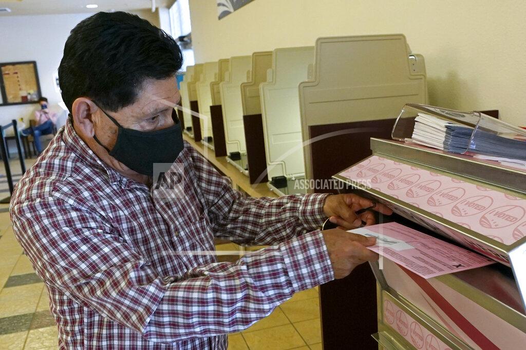 Rich Pedroncelli FILE — In this Aug. 30, 2021 file photo, Francisco Torres casts his ballot at the Sacramento County Registrar of Voters office in Sacramento, Calif. California Gov. Gavin Newsom is facing the second recall of a California governor since Republican Arnold Schwarzenegger unseated Democratic Gov. Gray Davis in 2003. Today's California electorate is less Republican and more Asian and Latino than it was 18 years ago, trends that favor Newsom. (AP Photo/Rich Pedroncelli, File)