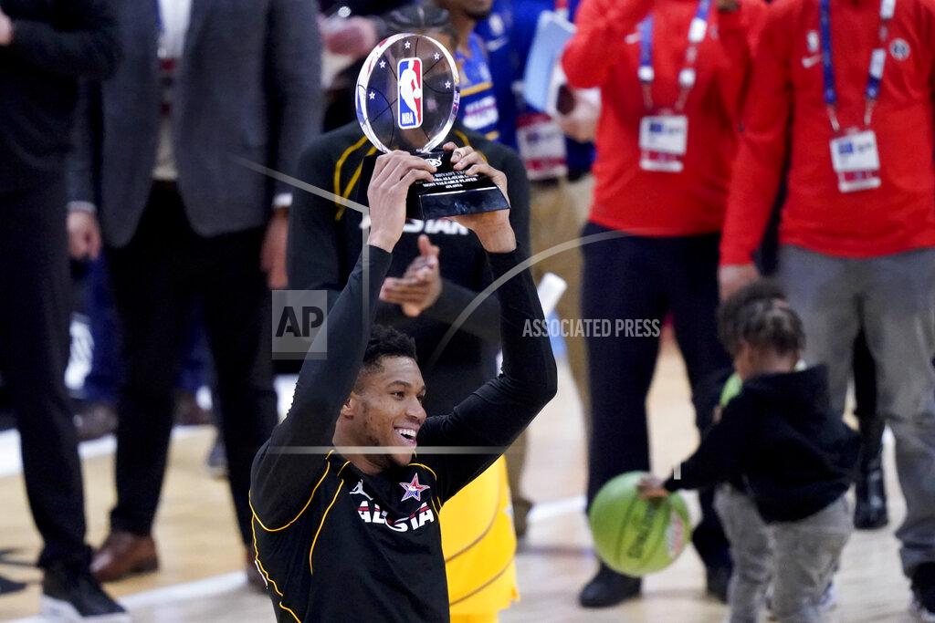 Brynn Anderson Milwaukee Bucks forward Giannis Antetokounmpo hols up the trophy after basketball's NBA All-Star Game in Atlanta, Sunday, March 7, 2021. (AP Photo/Brynn Anderson)