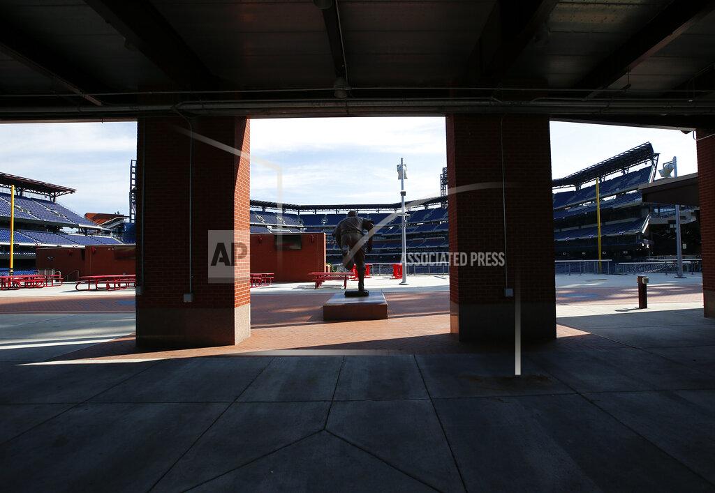 Yong Kim An empty Ashburn Alley faces seats at Citizens Bank Park on Monday, July 27, 2020, in Philadelphia. The Philadelphia Phillies' game against the New York Yankees on Monday was postponed after several members of the Miami Marlins tested positive for the coronavirus. (Yong Kim/The Philadelphia Inquirer via AP)