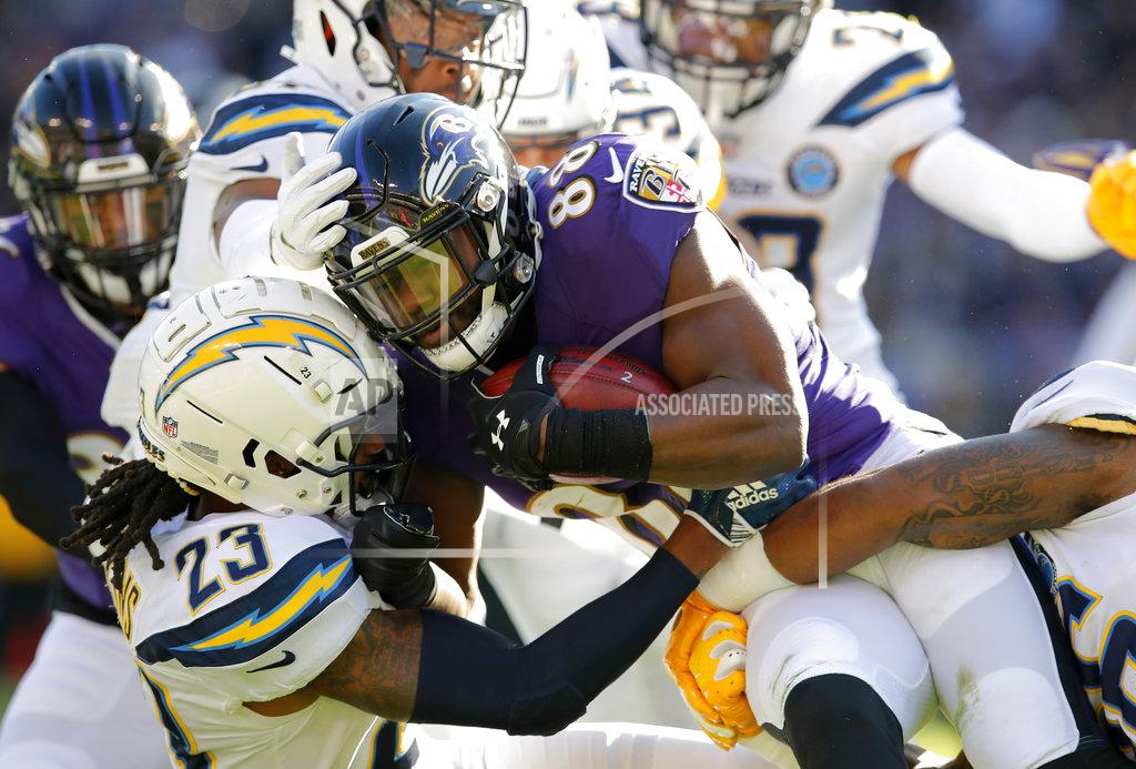 Carolyn Kaster Baltimore Ravens running back Ty Montgomery (88) is tackled by Los Angeles Chargers defensive back Rayshawn Jenkins (23) as he rushes the ball in the first half of an NFL wild card playoff football game, Sunday, Jan. 6, 2019, in Baltimore. (AP Photo/Carolyn Kaster)