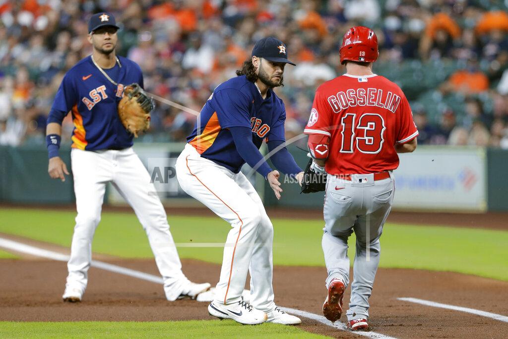 Michael Wyke Houston Astros starting pitcher Lance McCullers Jr., middle, makes the tag on Los Angeles Angels left fielder Phil Gosselin (13) on his infield grounder as first baseman Yuli Gurriel, left, looks on during the second inning of a baseball game Sunday, Sept. 12, 2021, in Houston. (AP Photo/Michael Wyke)